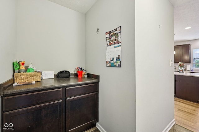 8126 Kilborn Way, Avon, IN 46123 - bar with a textured ceiling and wood finished floors