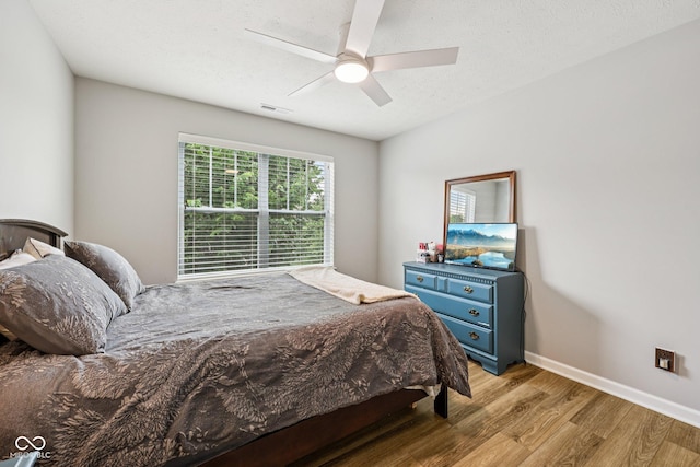 8126 Kilborn Way, Avon, IN 46123 - bedroom featuring wood finished floors and a ceiling fan