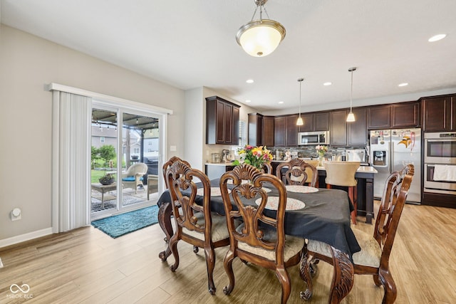 8126 Kilborn Way, Avon, IN 46123 - dining area featuring light wood-style flooring and recessed lighting