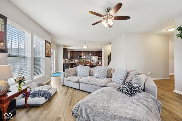 8126 Kilborn Way, Avon, IN 46123 - living room featuring light wood-type flooring and ceiling fan