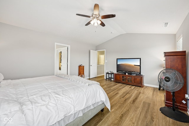 8126 Kilborn Way, Avon, IN 46123 - bedroom with light wood-style flooring, lofted ceiling, and a ceiling fan