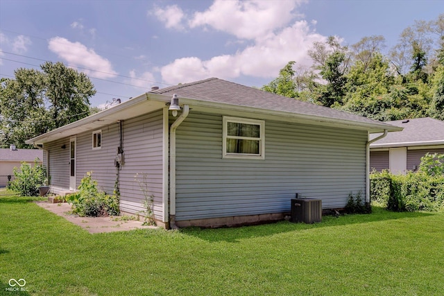 4218 E 18th St, Indianapolis, IN 46218 - view of home's exterior featuring a yard and a shingled roof