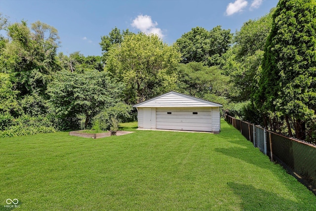 4218 E 18th St, Indianapolis, IN 46218 - view of yard featuring an outbuilding and a garage