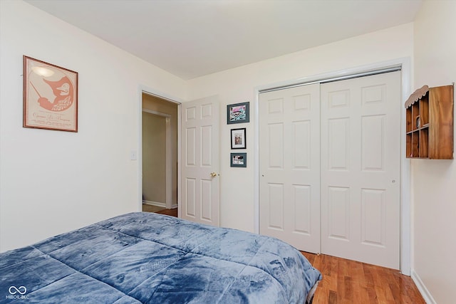 4218 E 18th St, Indianapolis, IN 46218 - bedroom featuring wood finished floors and a closet