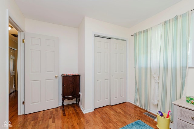 4218 E 18th St, Indianapolis, IN 46218 - bedroom with light wood finished floors and a closet