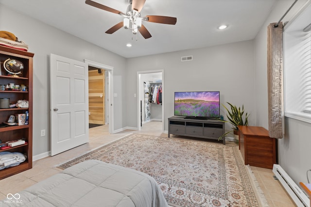 4434 Hickory Ridge Blvd, Greenwood, IN 46143 - bedroom featuring a baseboard heating unit, light tile patterned floors, a spacious closet, recessed lighting, and ceiling fan