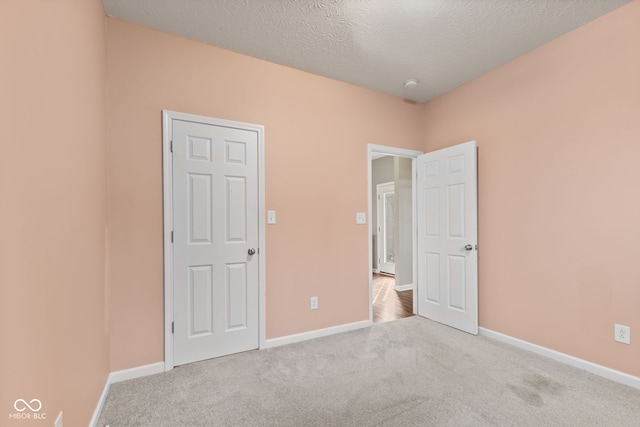 4434 Hickory Ridge Blvd, Greenwood, IN 46143 - unfurnished bedroom with carpet floors and a textured ceiling