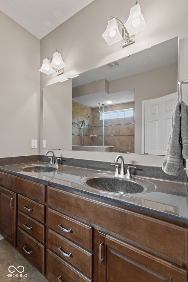 4434 Hickory Ridge Blvd, Greenwood, IN 46143 - bathroom featuring double vanity and a tile shower