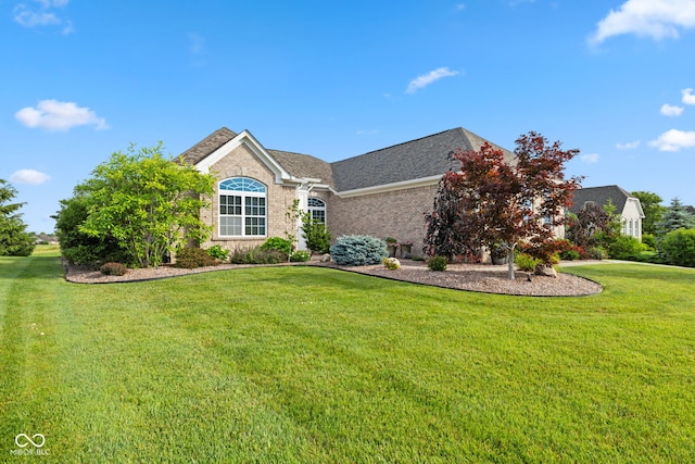 4434 Hickory Ridge Blvd, Greenwood, IN 46143 - view of front of property with a front yard and brick siding