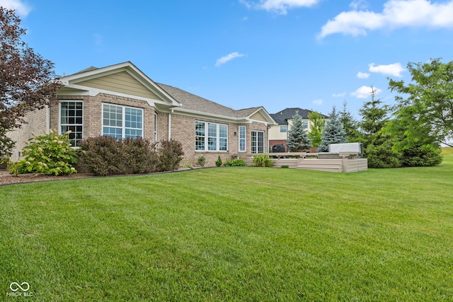 4434 Hickory Ridge Blvd, Greenwood, IN 46143 - rear view of property with brick siding and a yard