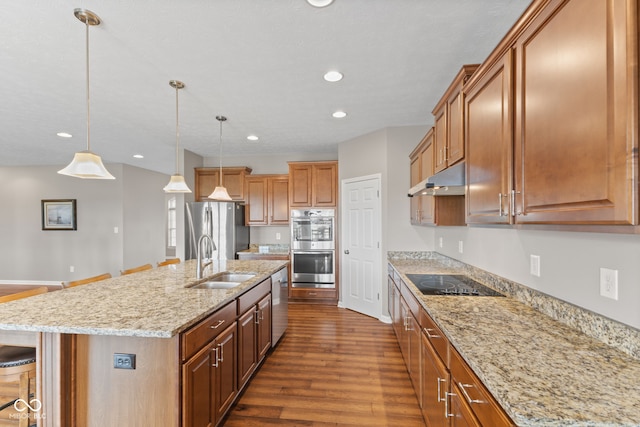 4434 Hickory Ridge Blvd, Greenwood, IN 46143 - kitchen featuring stainless steel appliances, dark wood-style flooring, a breakfast bar area, a kitchen island with sink, and recessed lighting