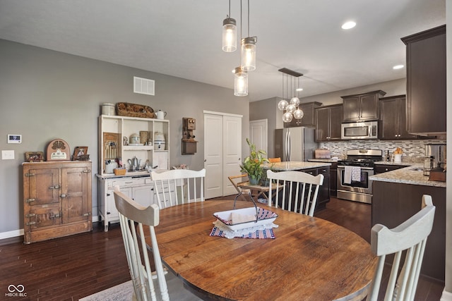 13992 Wynngate Ln, Fishers, IN 46038 - dining space with dark wood-style floors and recessed lighting