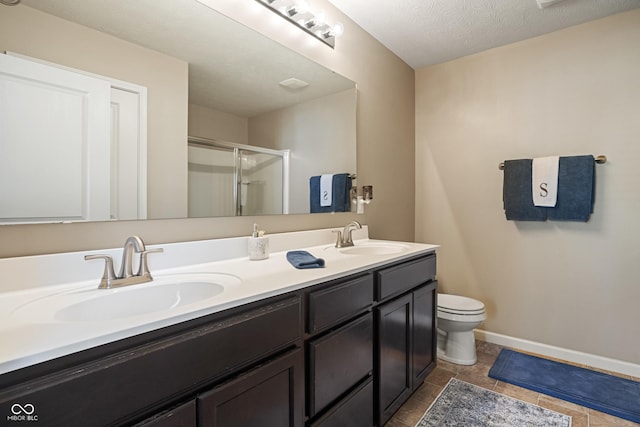 13992 Wynngate Ln, Fishers, IN 46038 - full bath featuring a shower stall, double vanity, and tile patterned flooring