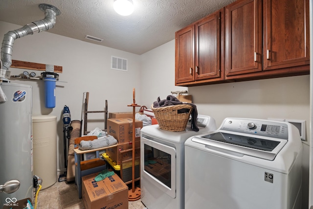 13992 Wynngate Ln, Fishers, IN 46038 - laundry area featuring cabinet space, separate washer and dryer, water heater, and a textured ceiling