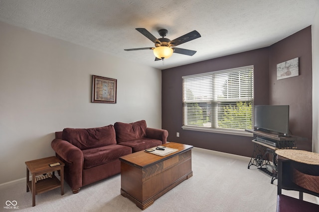 13992 Wynngate Ln, Fishers, IN 46038 - living room featuring light carpet, a ceiling fan, and a textured ceiling