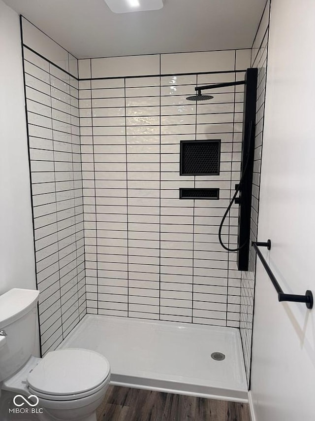 935 S County Road 185 E, North Vernon, IN 47265 - bathroom with a stall shower and wood finished floors