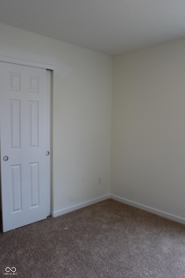 1029 E Brandy Blvd E, Ellettsville, IN 47429 - carpeted empty room with baseboards