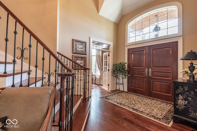 4636 S Hawks Way, Bloomington, IN 47401 - entrance foyer featuring dark wood-style floors, stairs, and high vaulted ceiling