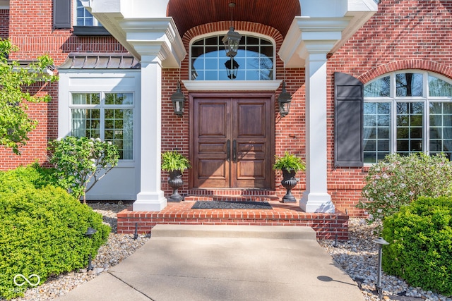 4636 S Hawks Way, Bloomington, IN 47401 - view of exterior entry with brick siding and a standing seam roof