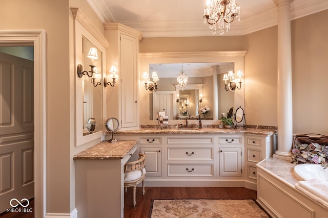 4636 S Hawks Way, Bloomington, IN 47401 - full bath featuring a chandelier, vanity, crown molding, wood finished floors, and a tub