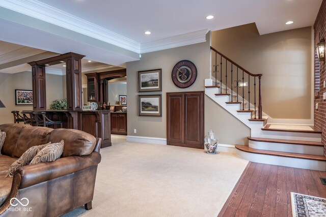 4636 S Hawks Way, Bloomington, IN 47401 - living area featuring ornamental molding, stairway, recessed lighting, and wood finished floors