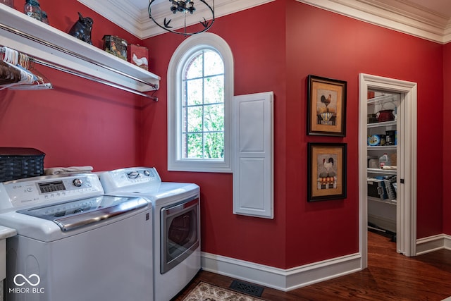 4636 S Hawks Way, Bloomington, IN 47401 - washroom featuring ornamental molding, washing machine and clothes dryer, and dark wood finished floors