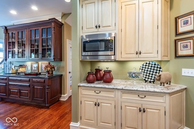 4636 S Hawks Way, Bloomington, IN 47401 - kitchen with stainless steel microwave, dark wood-type flooring, glass insert cabinets, and recessed lighting