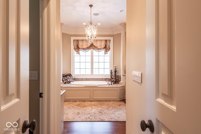 4636 S Hawks Way, Bloomington, IN 47401 - full bathroom with a chandelier, ornamental molding, a garden tub, and wood finished floors