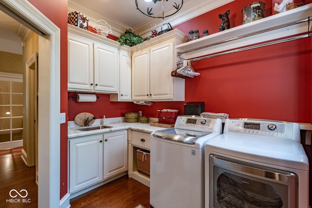 4636 S Hawks Way, Bloomington, IN 47401 - washroom featuring washer and dryer, cabinet space, dark wood finished floors, and crown molding