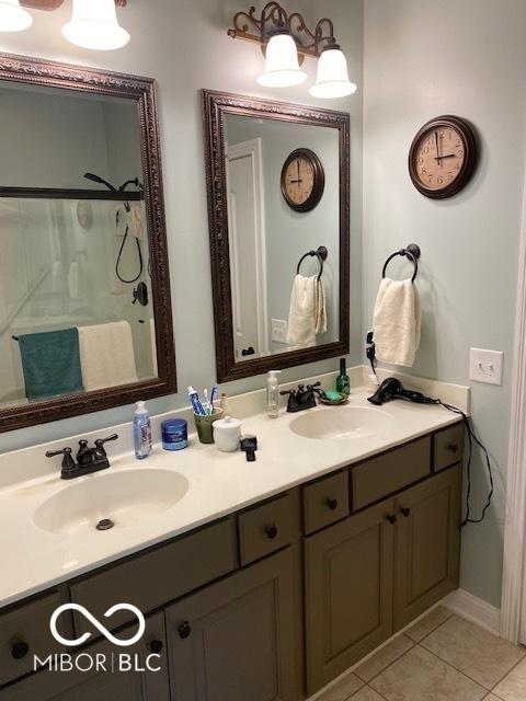 3354 Nottinghill Dr, Plainfield, IN 46168 - bathroom with double vanity, tile patterned flooring, and a shower