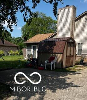 241 Deborah Ln, Whiteland, IN 46184 - view of side of property with a chimney