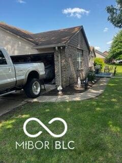241 Deborah Ln, Whiteland, IN 46184 - view of property exterior featuring a yard and an attached garage