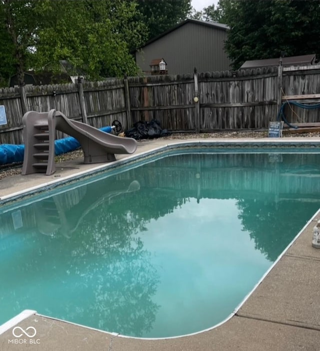 241 Deborah Ln, Whiteland, IN 46184 - view of swimming pool featuring a water slide and a fenced backyard