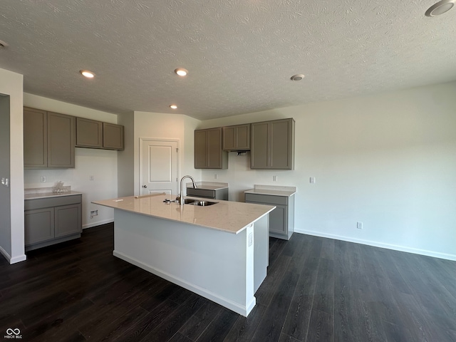 7909 Magnolia St, New Palestine, IN 46163 - kitchen featuring a center island with sink, dark wood-type flooring, gray cabinets, a textured ceiling, and recessed lighting
