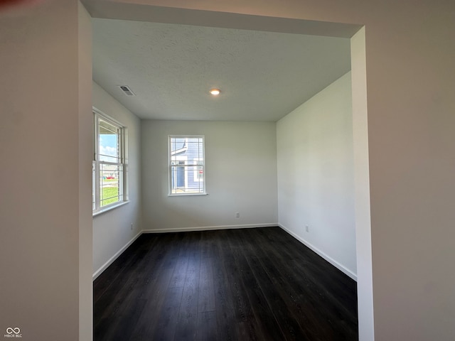 7909 Magnolia St, New Palestine, IN 46163 - spare room featuring dark wood-style flooring and recessed lighting