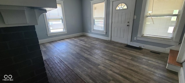 435 N Rural St NE, Indianapolis, IN 46201 - foyer with baseboards and dark wood-type flooring
