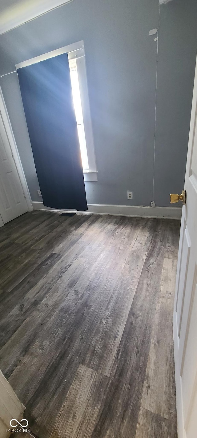 435 N Rural St NE, Indianapolis, IN 46201 - empty room with wood finished floors and baseboards