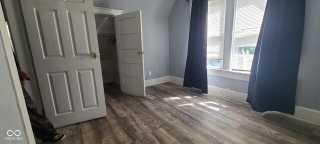 435 N Rural St NE, Indianapolis, IN 46201 - unfurnished bedroom with dark wood-type flooring and arched walkways