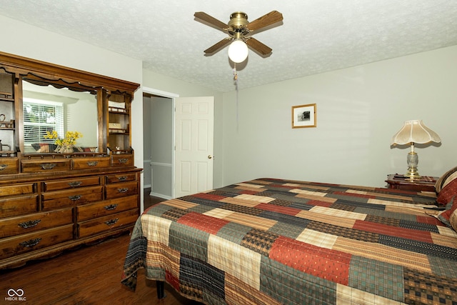 13 Fairlane Dr, Brownsburg, IN 46112 - bedroom featuring dark wood-style flooring, a textured ceiling, and a ceiling fan