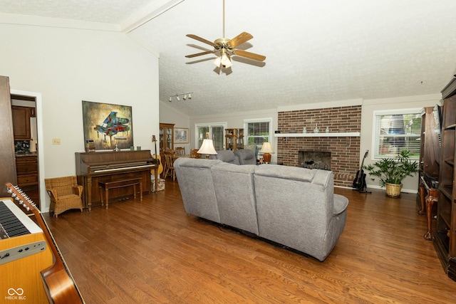 13 Fairlane Dr, Brownsburg, IN 46112 - living room featuring dark wood-style floors, ceiling fan, a textured ceiling, and a fireplace