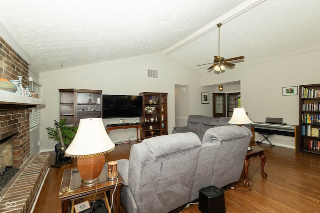 13 Fairlane Dr, Brownsburg, IN 46112 - living room featuring a fireplace, wood finished floors, a textured ceiling, ceiling fan, and lofted ceiling
