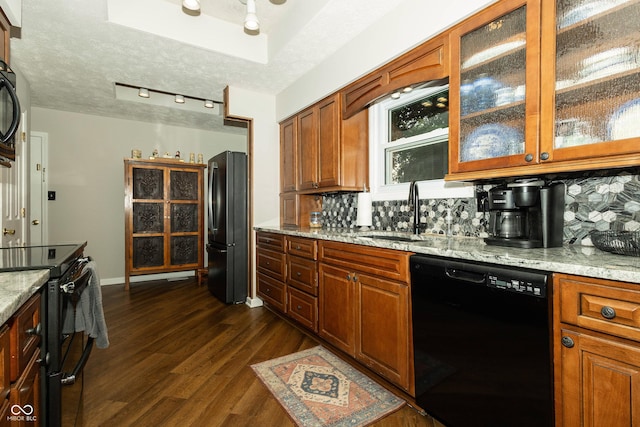 13 Fairlane Dr, Brownsburg, IN 46112 - kitchen with black appliances, decorative backsplash, dark wood finished floors, and light stone countertops
