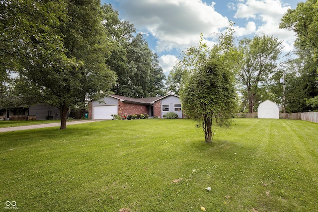 13 Fairlane Dr, Brownsburg, IN 46112 - view of front of property with a garage, a storage unit, driveway, and brick siding