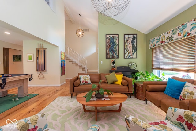 2608 S Trotters Run, Bloomington, IN 47401 - living room with wood finished floors, stairs, high vaulted ceiling, and beam ceiling