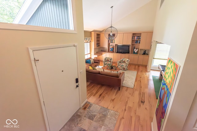 2608 S Trotters Run, Bloomington, IN 47401 - living area with high vaulted ceiling and light wood finished floors