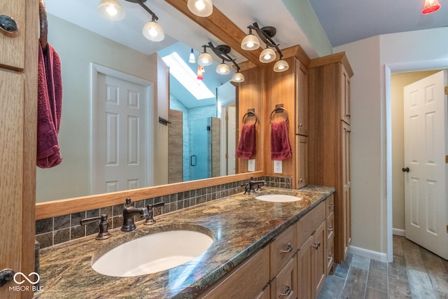2608 S Trotters Run, Bloomington, IN 47401 - bathroom with a shower stall, double vanity, and decorative backsplash