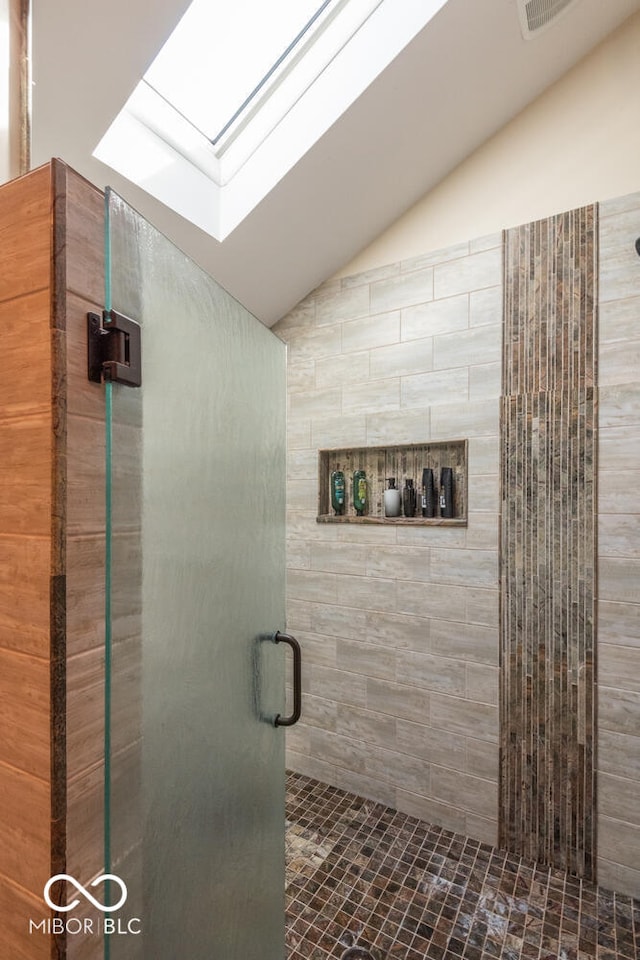2608 S Trotters Run, Bloomington, IN 47401 - full bathroom with vaulted ceiling, a skylight, and a stall shower