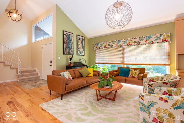 2608 S Trotters Run, Bloomington, IN 47401 - living room featuring wood finished floors, stairs, and high vaulted ceiling