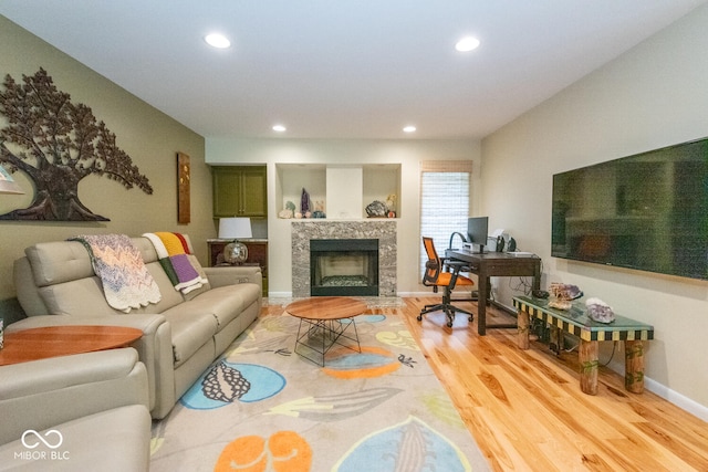 2608 S Trotters Run, Bloomington, IN 47401 - living room with recessed lighting, light wood finished floors, an office area, and a tiled fireplace