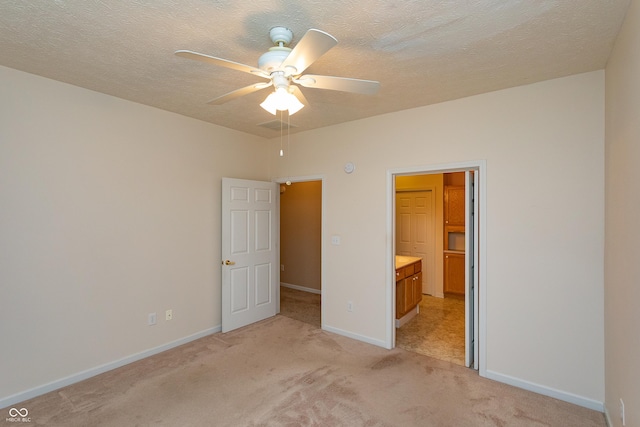 3631 Senior Pl, West Lafayette, IN 47906 - unfurnished bedroom featuring light carpet, ensuite bath, and a textured ceiling